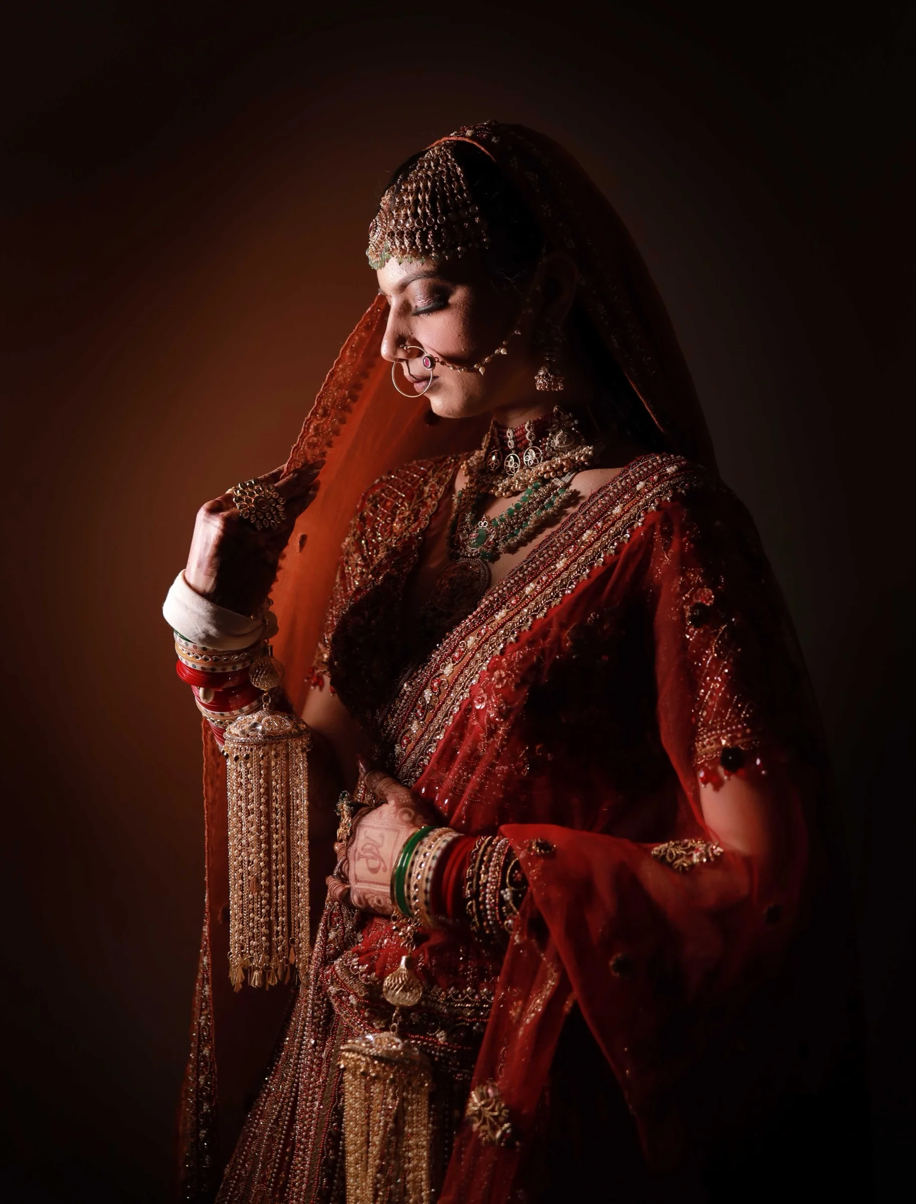 Bride in red illuminated in a cinematic portrait